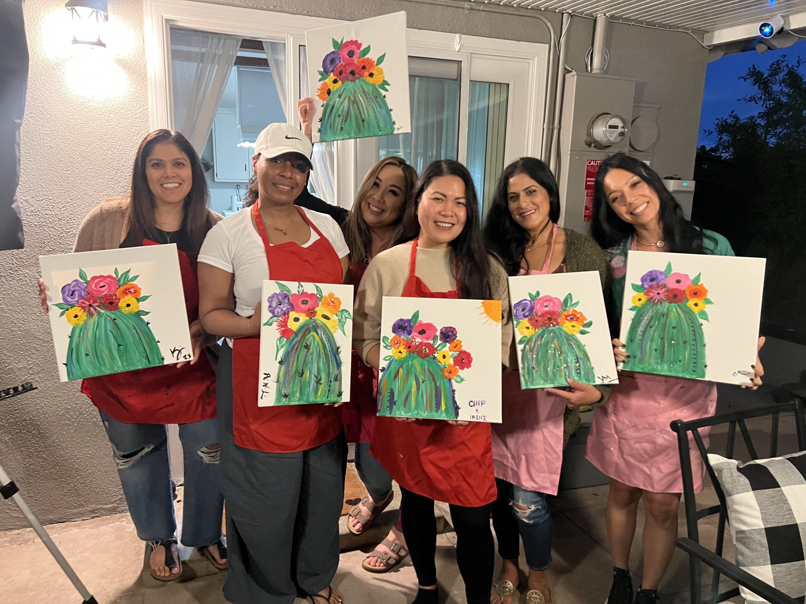 Guests painting at a Jenn's Urban Canvas party